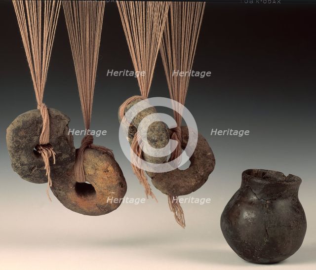Clay loomweights and pot. Creator: Unknown.