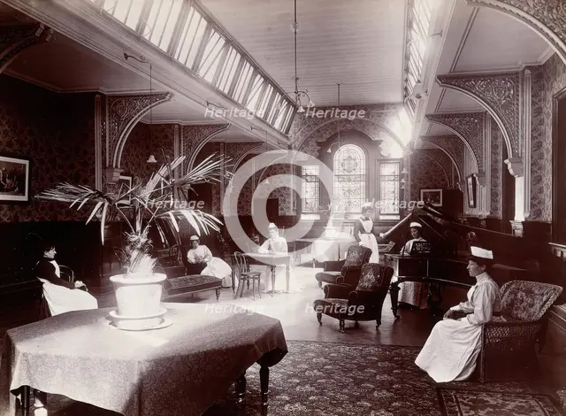 Claybury Asylum, Woodford, Essex: a nurses' day-room (?), (1893?). Creator: London & County Photographic Co.