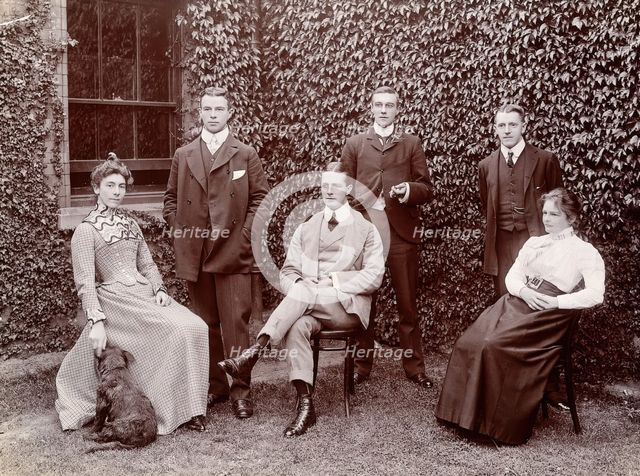 Claybury Asylum, Woodford, Essex: six members of staff, and a dog, (1893?). Creator: London & County Photographic Co.
