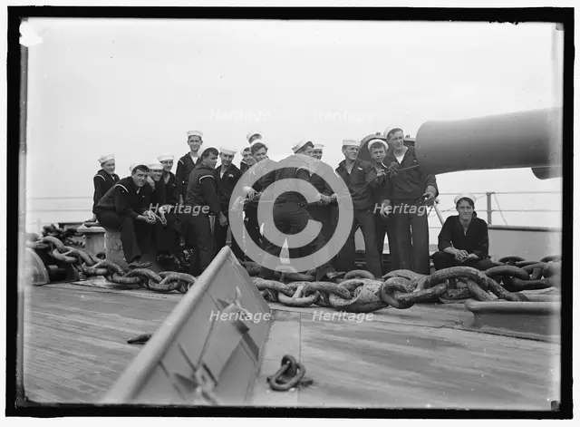Cleaning 12' gun, between 1910 and 1920. Creator: Harris & Ewing.