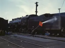 Cleaning an engine near the roundhouse, C. M. St. P. & P. R.R., Bensenville, Ill., 1943. Creator: Jack Delano