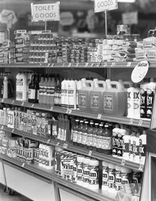 Cleaning products on supermarket shelves, 1966. Creator: Michael Walters
