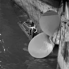 Cleaning the propellor of a ship, London Docks, September 1965. Artist: John Gay