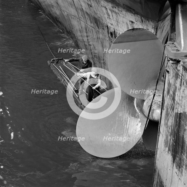 Cleaning the propellor of a ship, London Docks, September 1965. Artist: John Gay