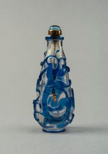 Clear glass snuff bottle with blue overlay, China, Qing dynasty, 1644-1911. Creator: Unknown