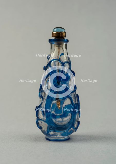 Clear glass snuff bottle with blue overlay, China, Qing dynasty, 1644-1911. Creator: Unknown.