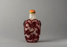 Clear glass snuff bottle with red overlay, China, Qing dynasty, 1644-1911. Creator: Unknown