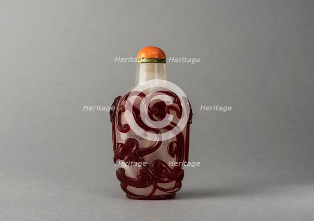 Clear glass snuff bottle with red overlay, China, Qing dynasty, 1644-1911. Creator: Unknown.