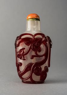 Clear glass snuff bottle with red overlay, China, Qing dynasty, 1644-1911. Creator: Unknown