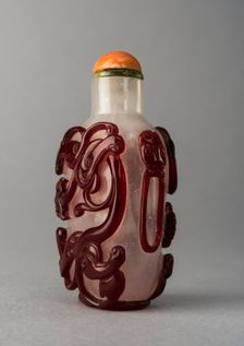 Clear glass snuff bottle with red overlay, China, Qing dynasty, 1644-1911. Creator: Unknown