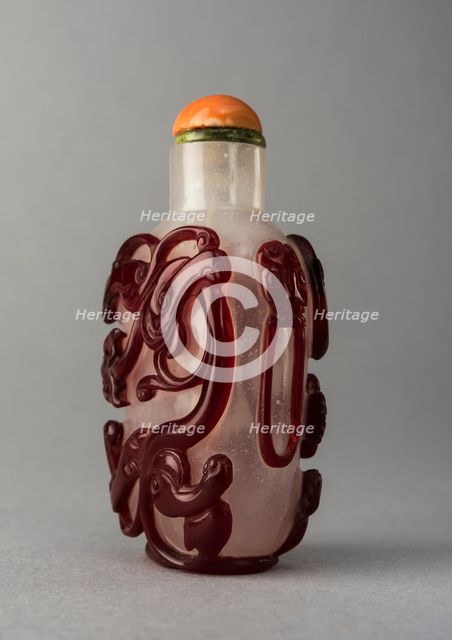 Clear glass snuff bottle with red overlay, China, Qing dynasty, 1644-1911. Creator: Unknown.