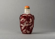 Clear glass snuff bottle with red overlay, China, Qing dynasty, 1644-1911. Creator: Unknown