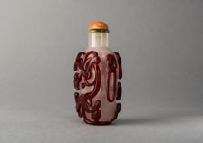 Clear glass snuff bottle with red overlay, China, Qing dynasty, 1644-1911. Creator: Unknown