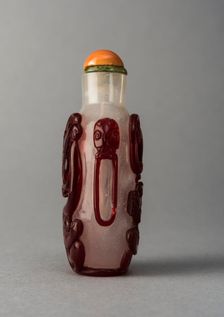 Clear glass snuff bottle with red overlay, China, Qing dynasty, 1644-1911. Creator: Unknown