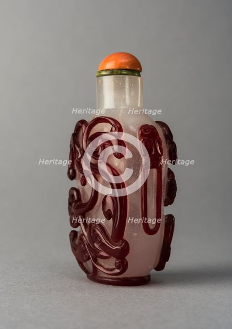 Clear glass snuff bottle with red overlay, China, Qing dynasty, 1644-1911. Creator: Unknown.