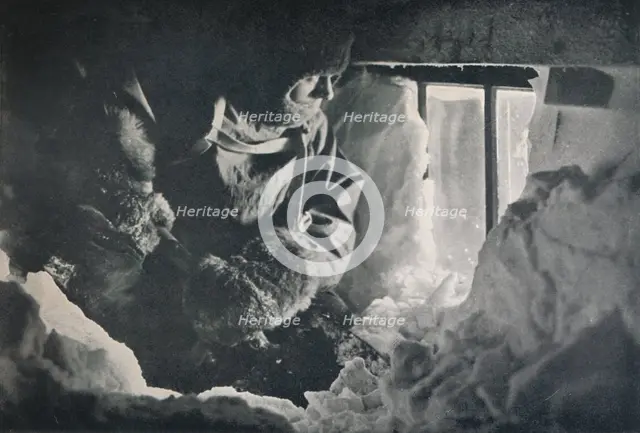 'Clearing Drift from Window of Hut at Cape Adare', c1911, (1913). Artist: G Murray Levick.