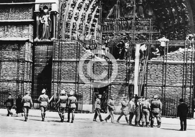 Clearing of sandbag protection from the facade of Notre Dame, German-occupied Paris, 1940. Artist: Unknown