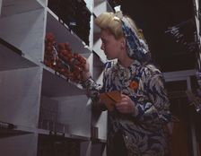 Clerk in one of the stock rooms of North American Aviation, Inc..., Inglewood, Calif. , 1942. Creator: Alfred T Palmer