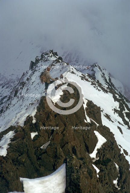 Climber on Crib Goch ridge on Snowdon.