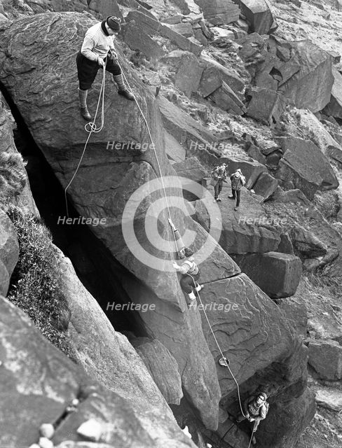 Climbers on Stanage Edge, Hathersage, Derbyshire, 1964.  Creator: Michael Walters.
