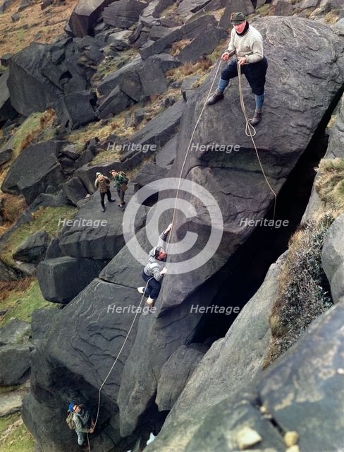 Climbers on Stanage Edge, Hathersage, Derbyshire, 1964.  Creator: Michael Walters.