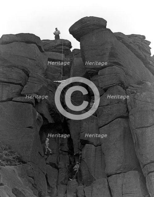 Climbers on Stanage Edge, Hathersage, Derbyshire, 1964.  Creator: Michael Walters.