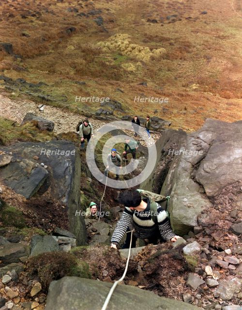 Climbers on Stanage Edge, Hathersage, Derbyshire, 1964.  Creator: Michael Walters.