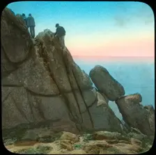 Climbing the Logan Rock, near Treen, Cornwall, late 19th or early 20th century. Artist: Church Army Lantern Department