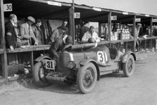 Clive Gallop and Leon Cushman's Aston Martin in the pits, JCC Double Twelve race, Brooklands, 1931. Artist: Bill Brunell