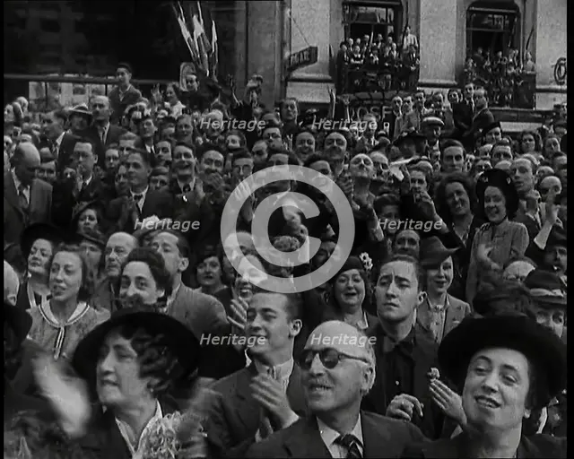 Close up a Section of the Crowd Spectating at  a Bastille Day Military Parade With People..., 1939. Creator: British Pathe Ltd.