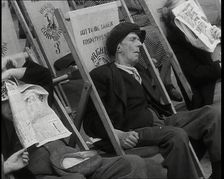 Close up on a Man in a Flat Cap and With a Neckerchief Sleeping in a Deck Chair on the Prom..., 1938 Creator: British Pathe Ltd