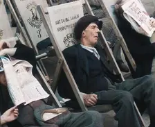 Close up on a Man in a Flat Cap and With a Neckerchief Sleeping in a Deck Chair on the Prom..., 1938 Creator: British Pathe Ltd