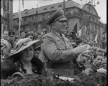 Close up of a German Nazi Party Official in a VIP Section of a Stand With Others Clapping..., 1938. Creator: British Pathe Ltd