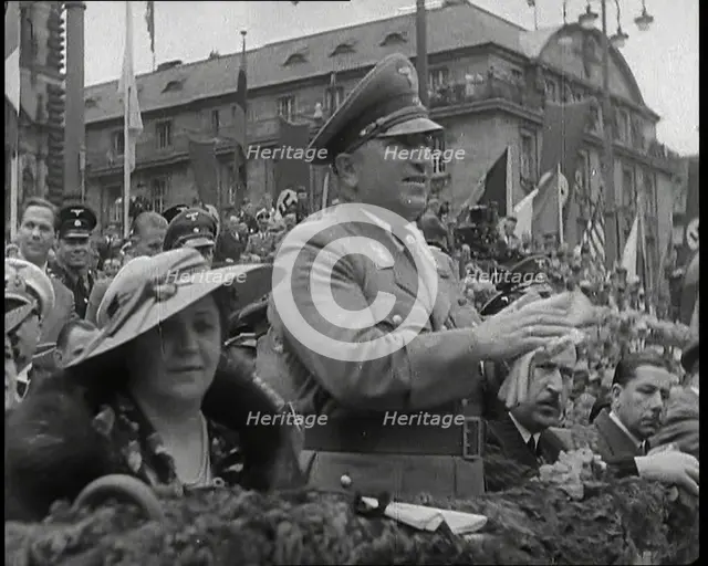 Close up of a German Nazi Party Official in a VIP Section of a Stand With Others Clapping..., 1938. Creator: British Pathe Ltd.