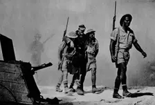 Close-up of a great battle. The Australians are bringing in a wounded prisoner 1942 (1944)