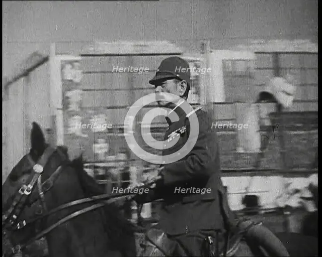 Close up of a Male Japanese Military Officer on Horseback Riding Along a Road During..., 1938. Creator: British Pathe Ltd.
