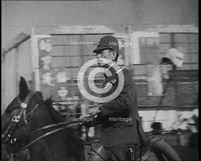 Close up of a Male Japanese Military Officer on Horseback Riding Along a Road During..., 1938. Creator: British Pathe Ltd.