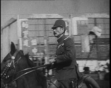 Close up of a Male Japanese Military Officer on Horseback Riding Along a Road During..., 1938. Creator: British Pathe Ltd