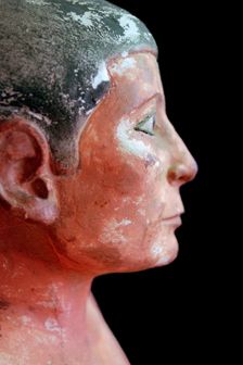 Close up of an Egyptian seated scribe model