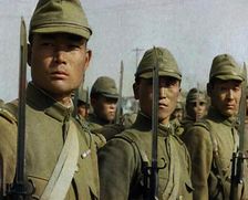 Close up of Male Japanese Soldiers Standing to Attention and Holding Their Bayonets Looking..., 1938 Creator: British Pathe Ltd
