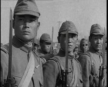 Close up of Male Japanese Soldiers Standing to Attention and Holding Their Bayonets Looking..., 1938 Creator: British Pathe Ltd