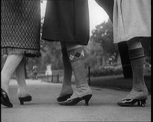 Close up Shot of Female Civilians Legs Wearing Wool Stockings, 1920. Creator: British Pathe Ltd