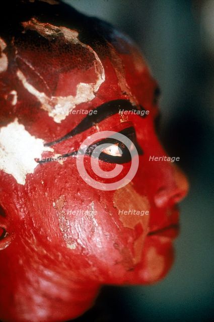 Closeup of head of Tutankhamun as a child emerging from a lotus flower. Artist: Unknown