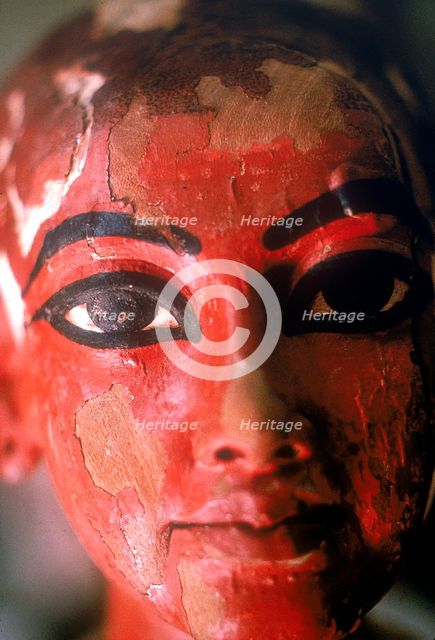 Closeup of head of Tutankhamun as a child emerging from a lotus flower. Artist: Unknown