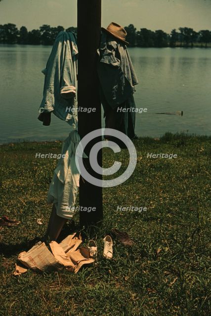 Clothes of swimmers hanging on a telegraph pole, Lake Providence, La., 1940. Creator: Marion Post Wolcott.