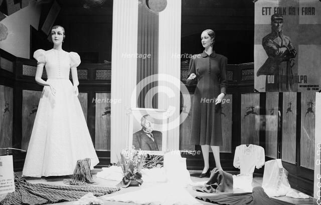 Clothes shop window with rwo mannequins, Malmö, Sweden, 1940. Artist: Unknown