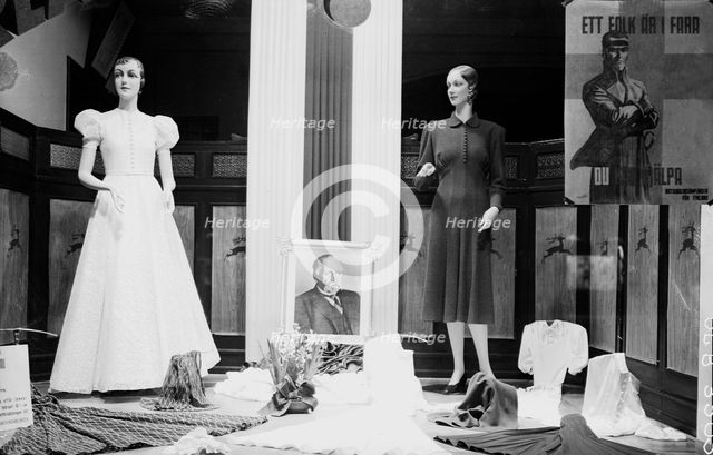 Clothes shop window with rwo mannequins, Malmö, Sweden, 1940. Creator: Unknown.