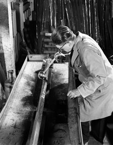 Crack detection on steel bars at J Beardshaw & Sons, Sheffield, South Yorkshire, 1963. Artist: Michael Walters