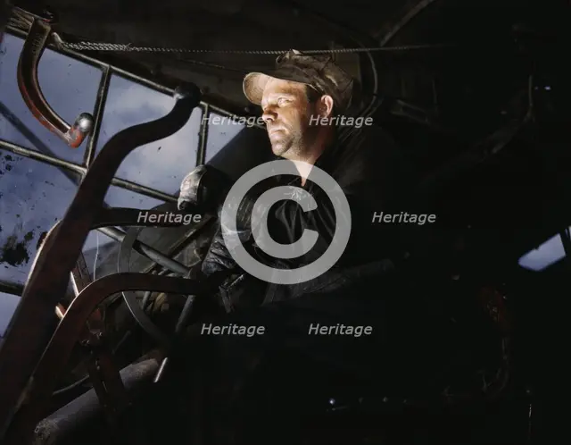 Crane operator at TVA's Douglas Dam, Tennessee, 1942. Creator: Alfred T Palmer.