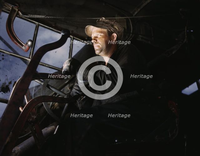 Crane operator at TVA's Douglas Dam, Tennessee, 1942. Creator: Alfred T Palmer.